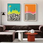 Modern living room with a brown sectional sofa, colorful abstract art on the wall, and a red side table.
