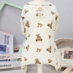 Baby romper with bear pattern on a mannequin against a neutral background