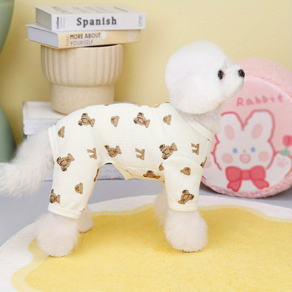 White dog toy with gold bow pattern on a yellow surface