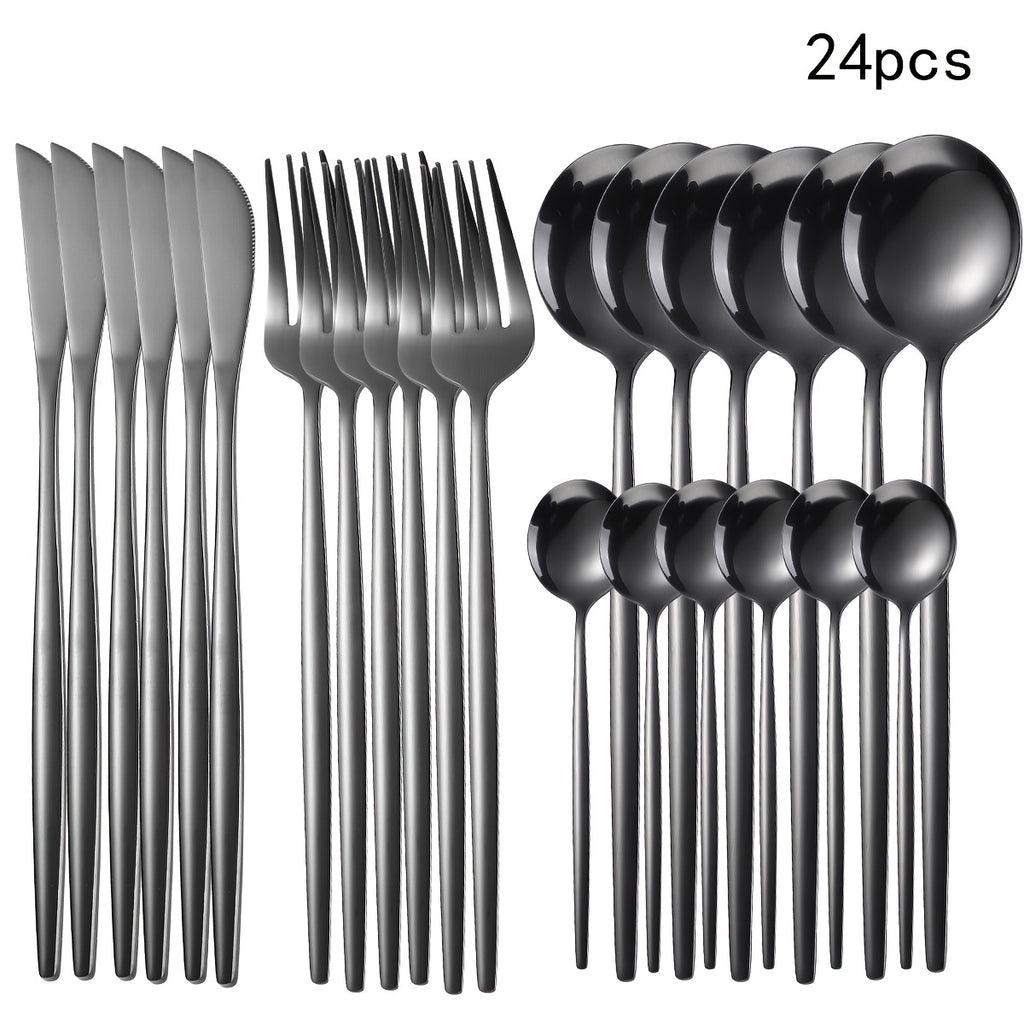 Set of 24 black flatware pieces including knives, forks, and spoons on a white background.