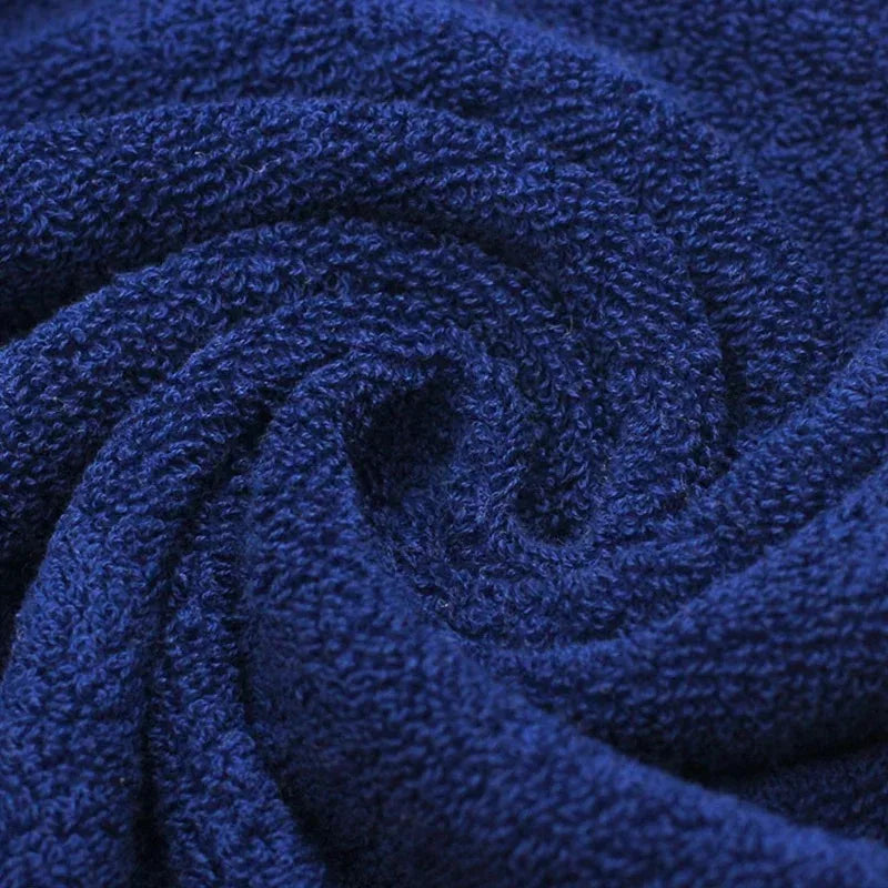 Close-up of a rolled-up blue towel with textured surface