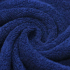 Close-up of a rolled-up blue towel with textured surface