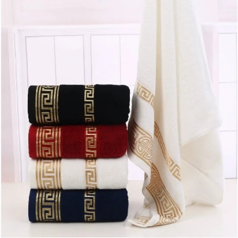 Stack of towels with decorative patterns on a white background