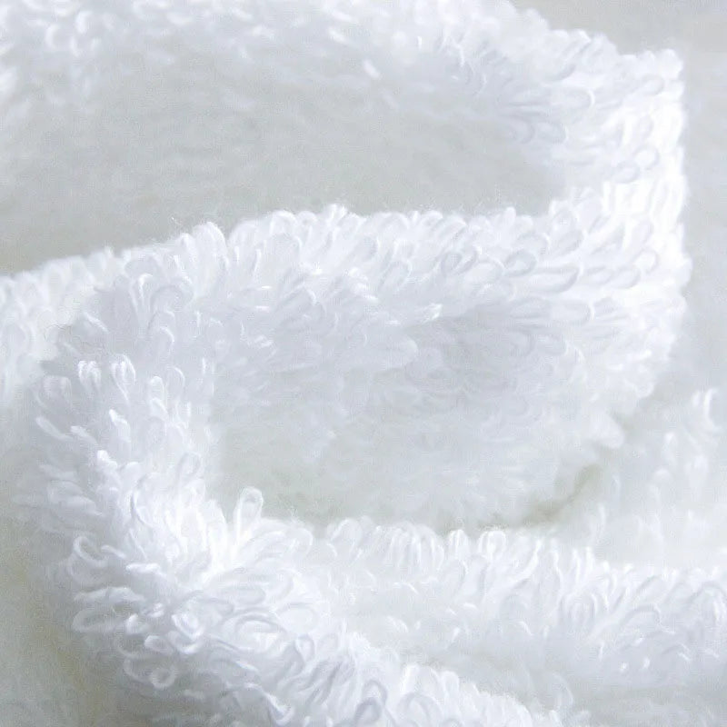 Close-up of white fluffy fabric on a light gray background