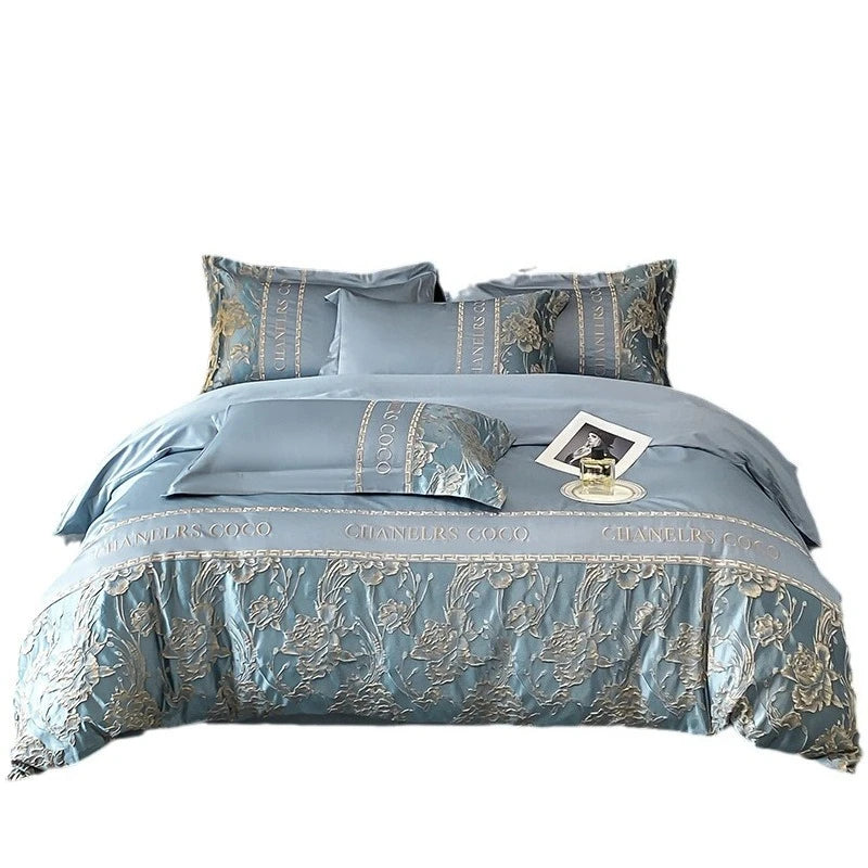 Blue bedding set with floral patterns on a white background
