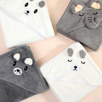 Cute animal-themed hooded towels on a neutral background