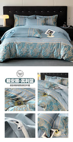 Blue bedding set with intricate patterns on a bed, featuring a brand logo.
