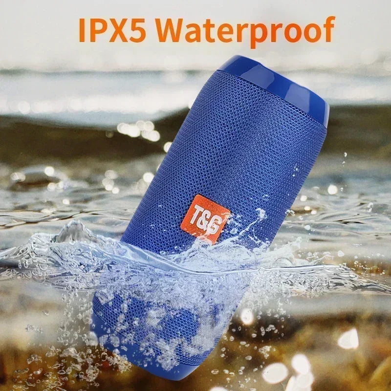 Blue waterproof speaker with IPX5 rating being submerged in water