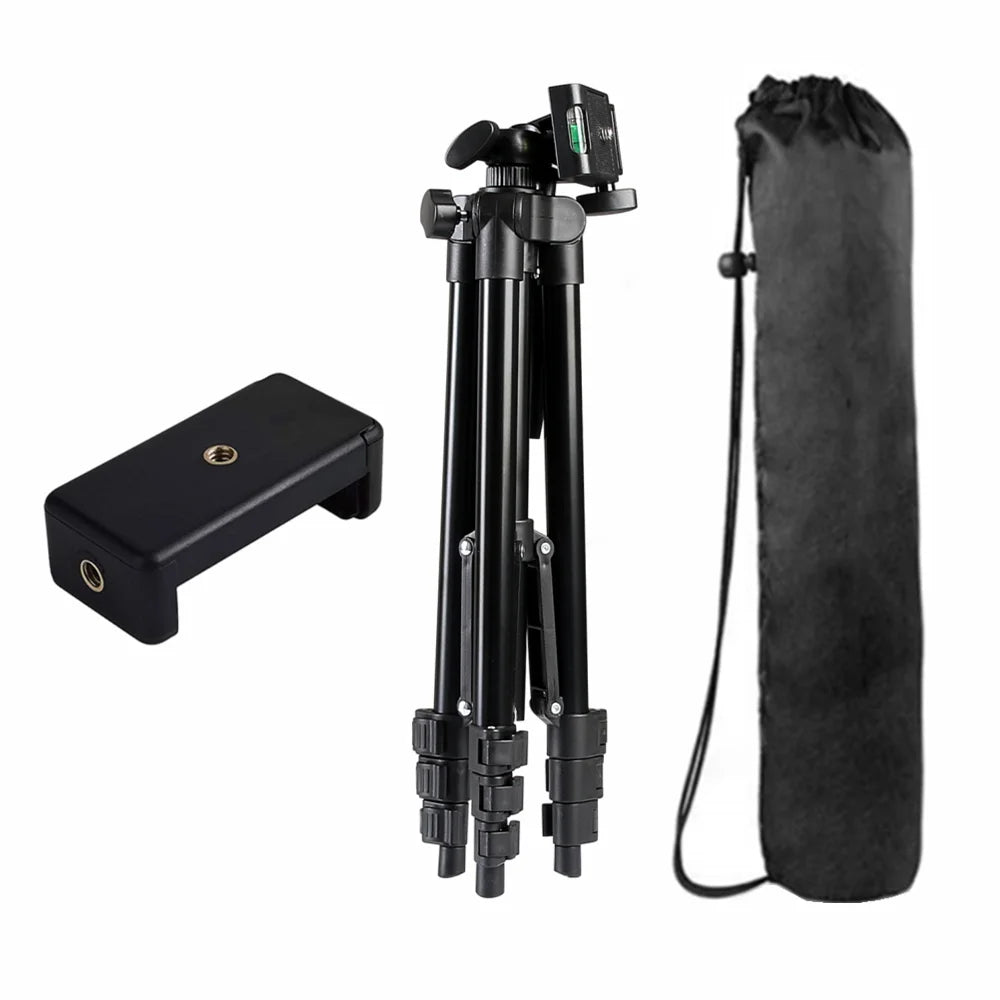 Black camera tripod with accessories on a white background