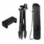 Black camera tripod with accessories on a white background