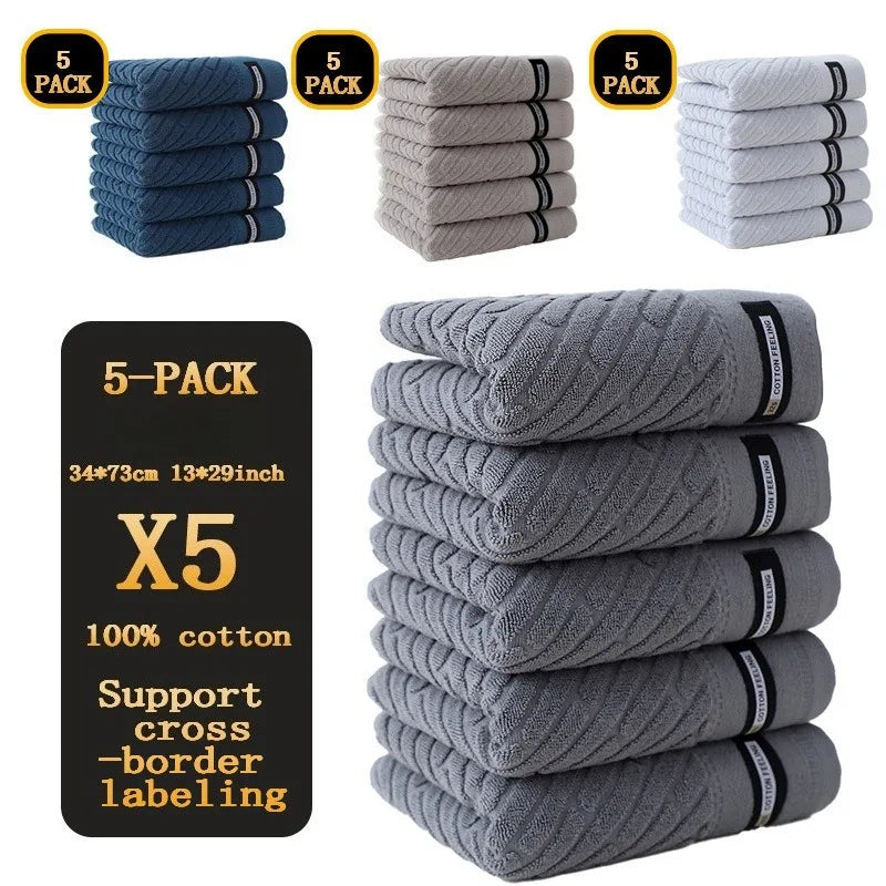Stack of gray towels with a label indicating a 5-pack size and material details.