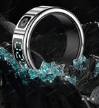 Silver digital ring with blue glowing display on a dark background