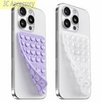 Two phone cases with bubble designs on a white background, one purple and one clear.