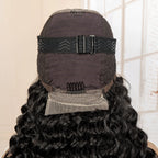 Back view of a wig with a black cap and adjustable straps on a neutral background