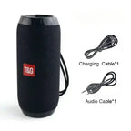 Black speaker with T&G logo, charging cable, and audio cable on a white background