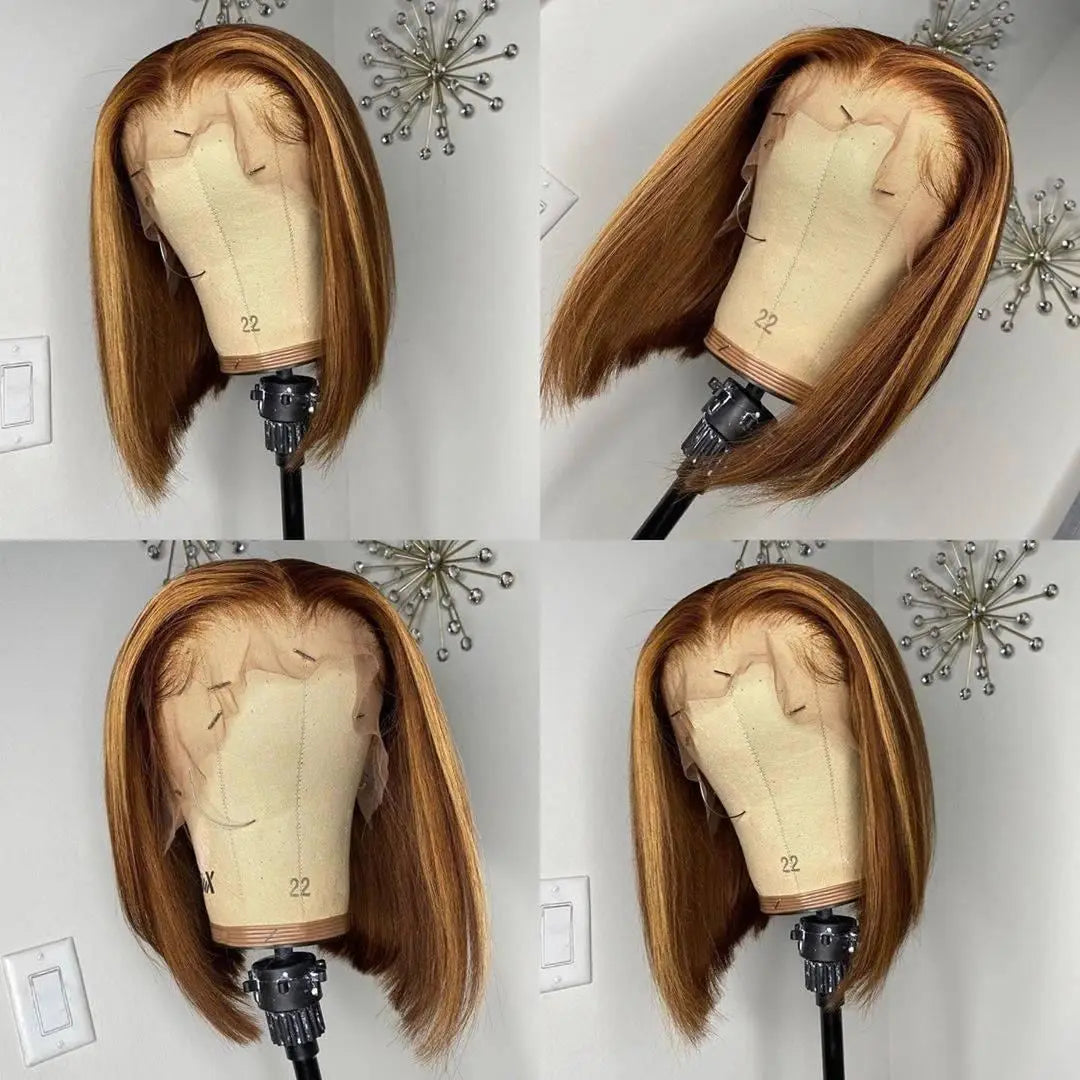 Brown wig on a mannequin head against a white wall with decorative elements.
