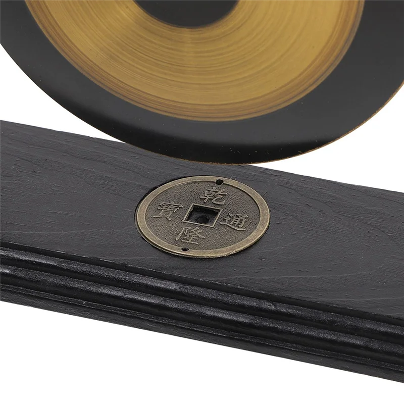 Black leather-bound book with a brass plate featuring East Asian characters on a white background