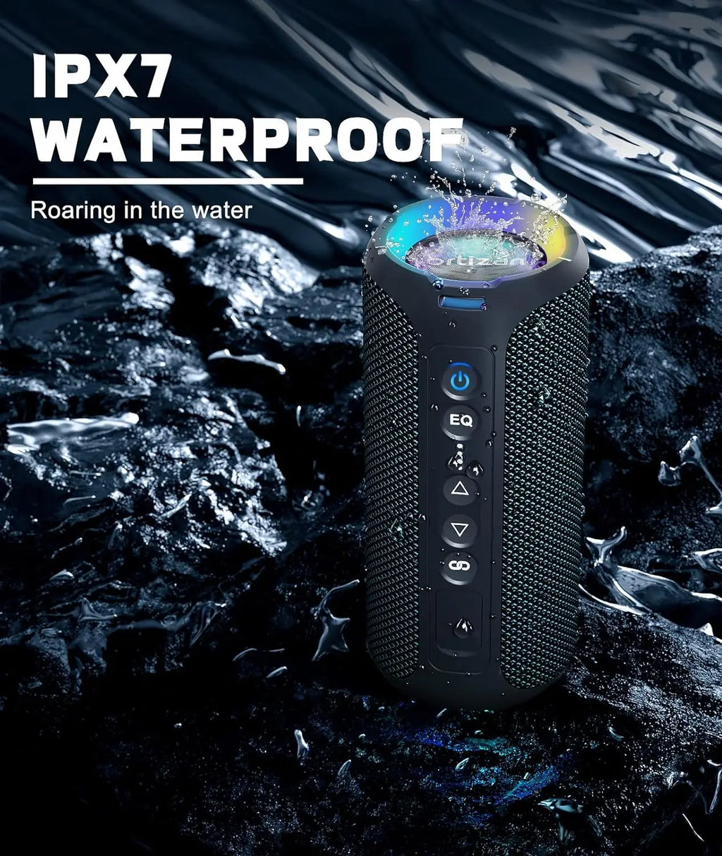 Waterproof speaker with IPX7 rating on a rocky surface with water