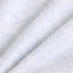 Close-up of textured white fabric with a subtle pattern
