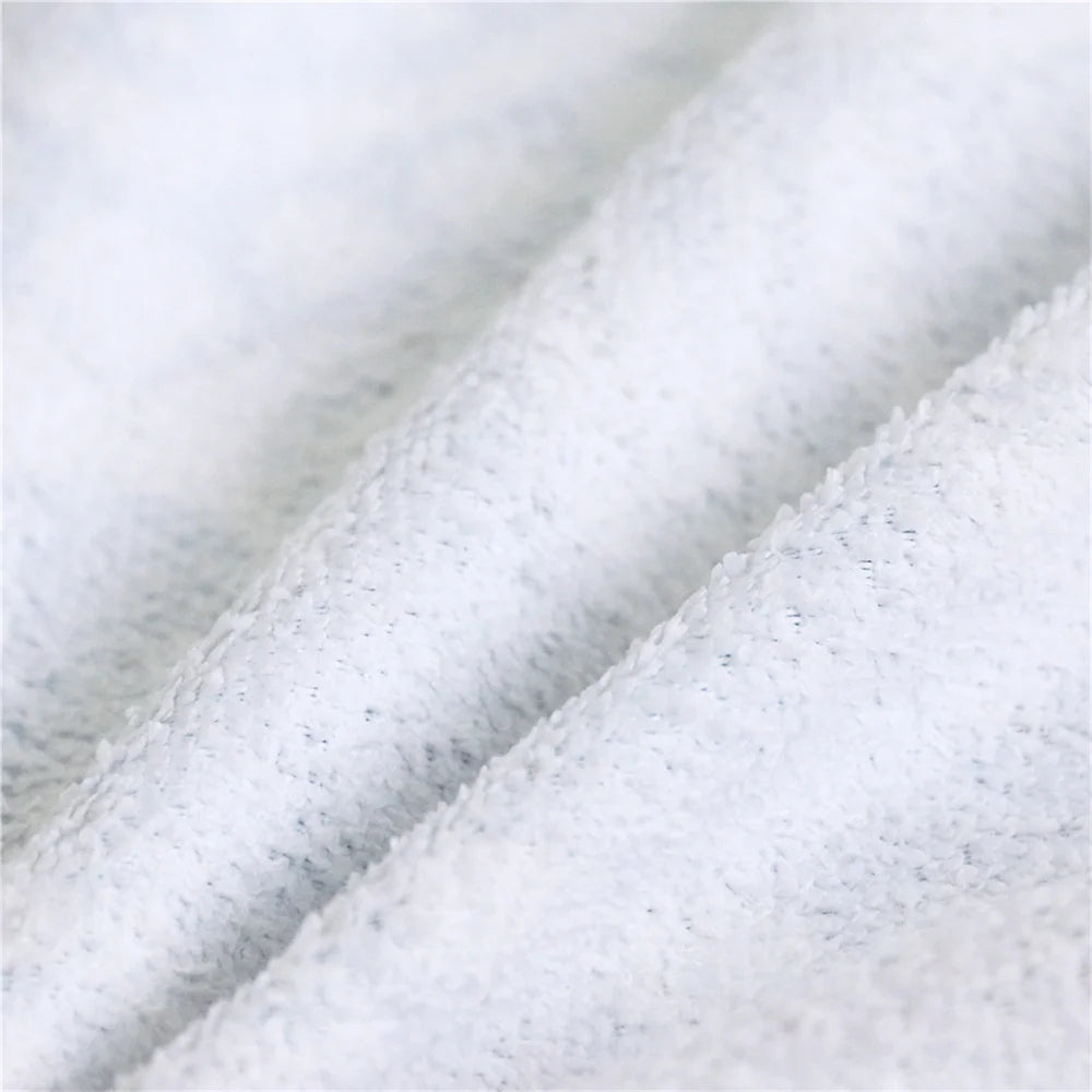 Close-up of textured white fabric with a subtle pattern