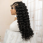 Mannequin head with a long black curly wig in a neutral setting
