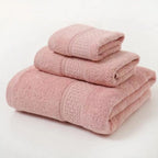 Stack of pink towels on a white background