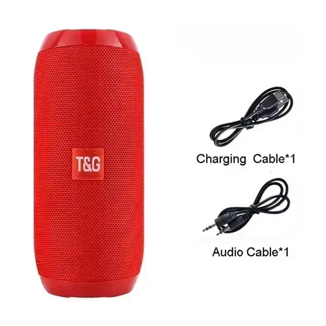 Red portable speaker with T&G logo, charging cable, and audio cable on a white background