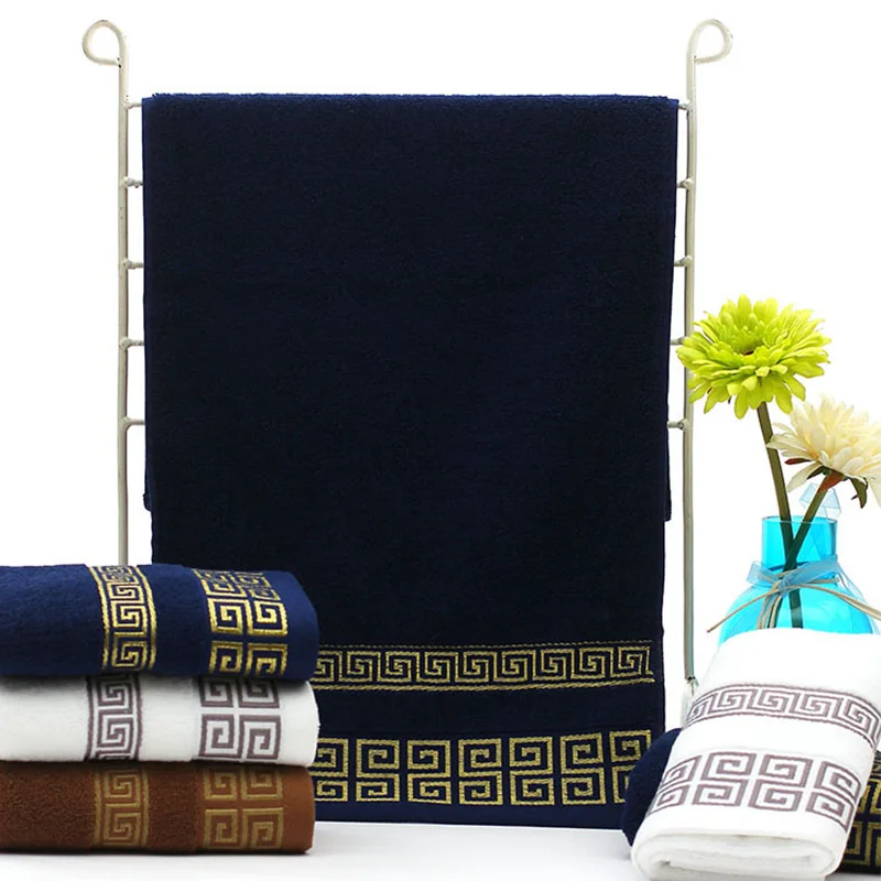 Set of towels with decorative patterns on a white background