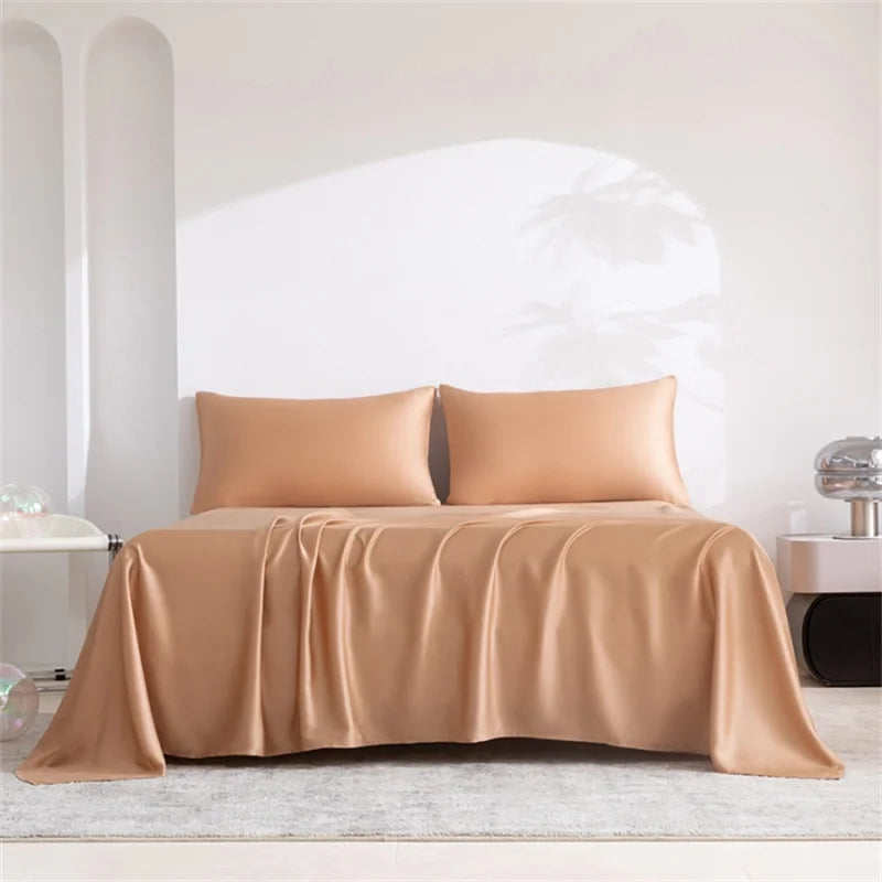 Beige bedspread and pillows on a bed in a minimalistic room.