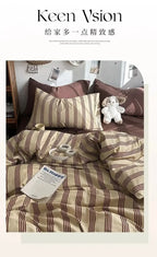 Striped bedding set with pillows and a teddy bear on a bed, featuring the brand 'Keen Vision'.