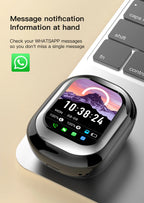 Smartwatch with a digital display on a beige background, featuring WhatsApp icon.