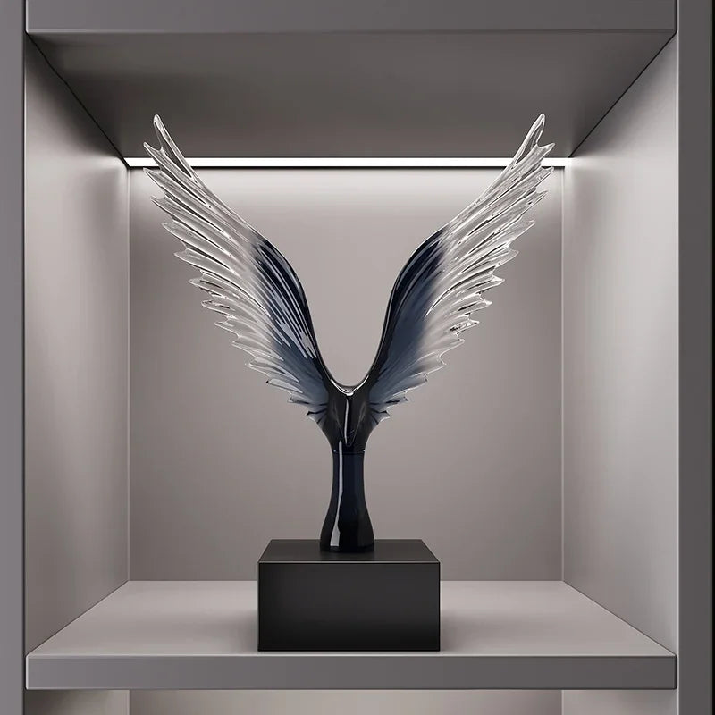 Decorative sculpture of wings on a pedestal in a modern interior setting