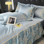 Luxurious blue bedding set with gold embroidery on a bed, featuring the brand 'LANEYS COCO'.