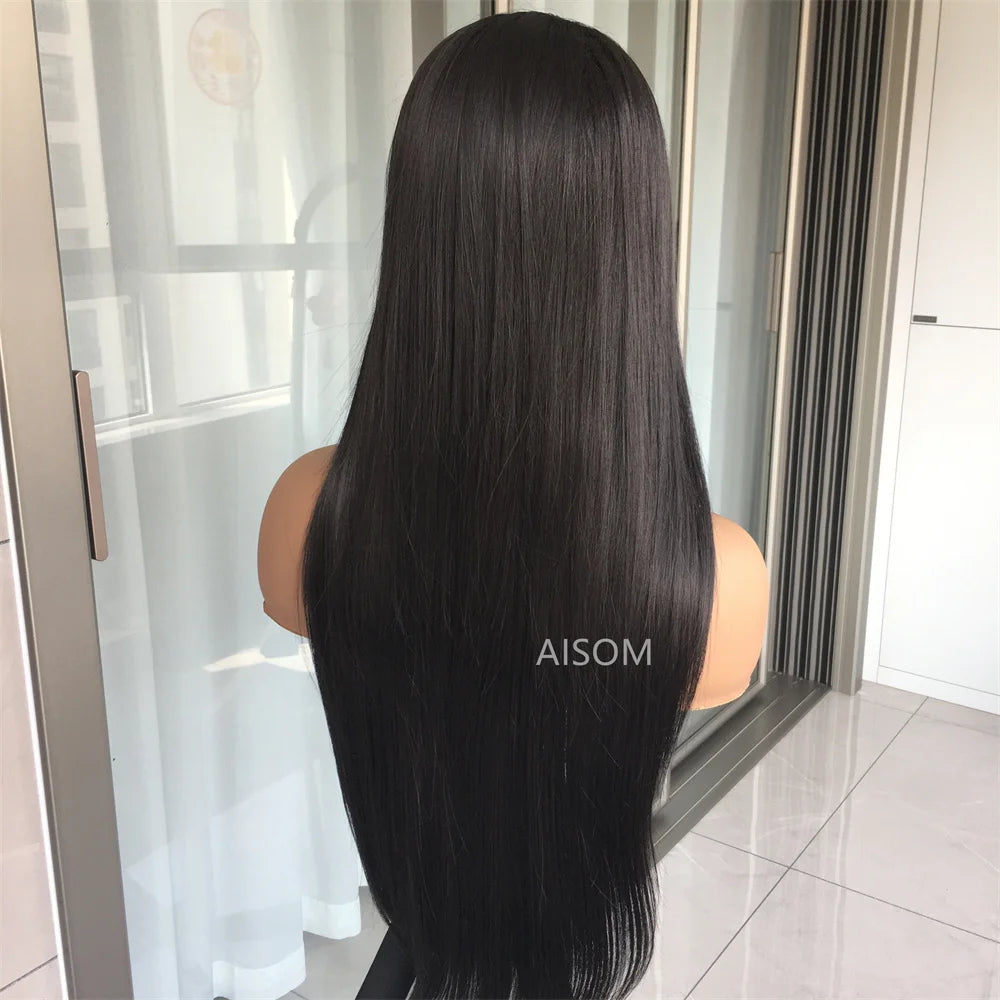 Mannequin head with long black hair in a room with a mirror and curtains.