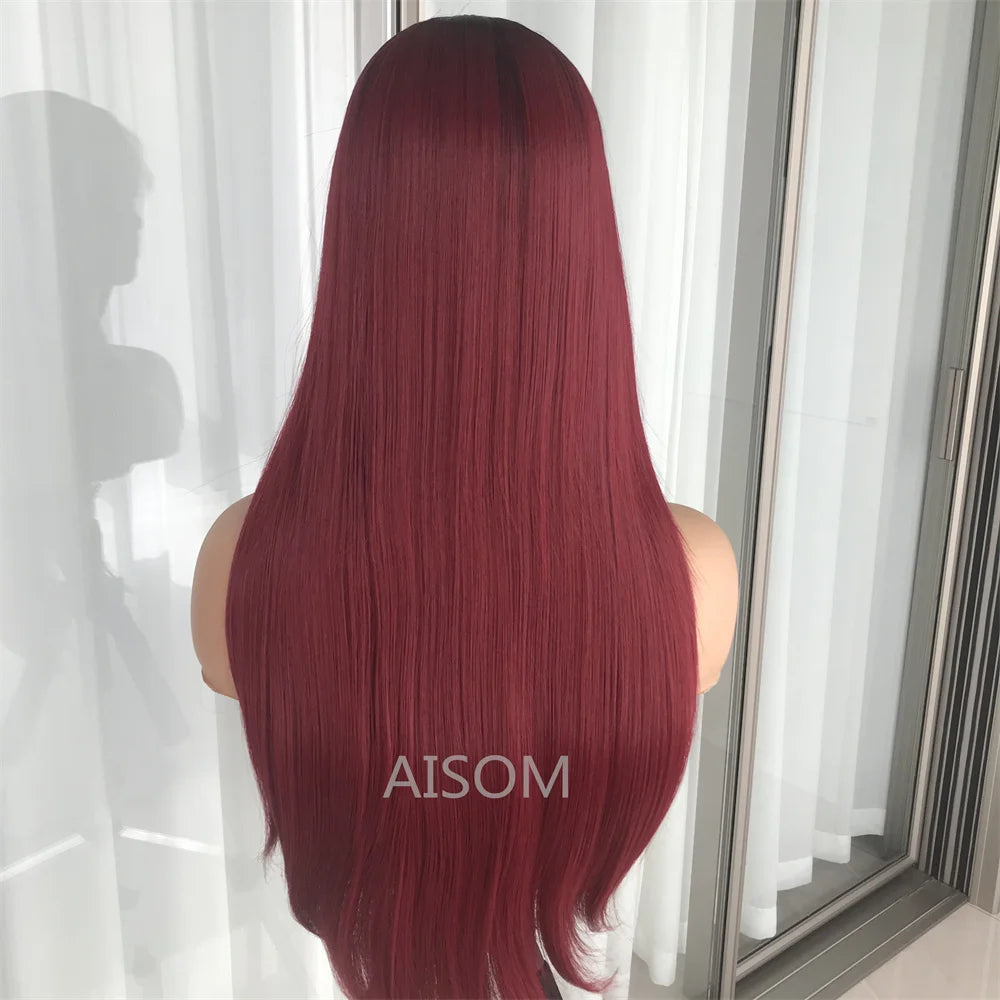 Person with long burgundy hair standing in front of a mirror, AISOM brand visible.