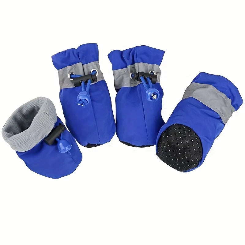 Set of blue dog boots with gray cuffs and black soles on a white background