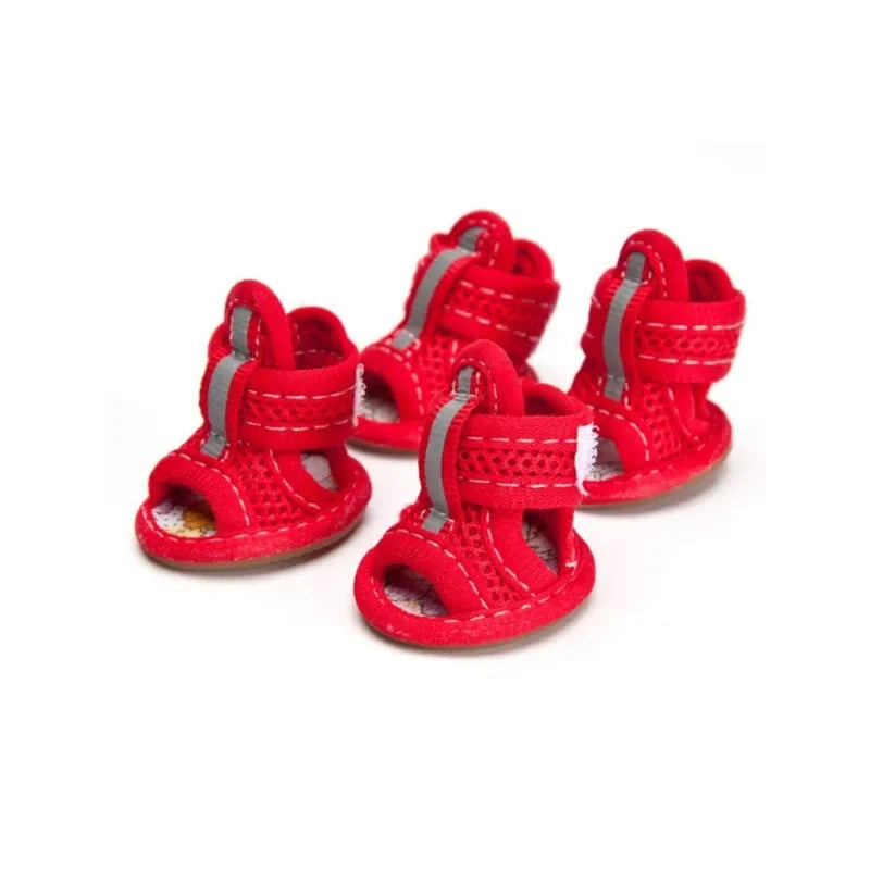 Red children's sandals with gray straps on a white background