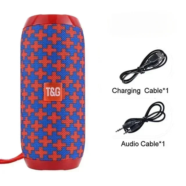 Blue and red patterned speaker with T&G logo, charging cable, and audio cable on a white background