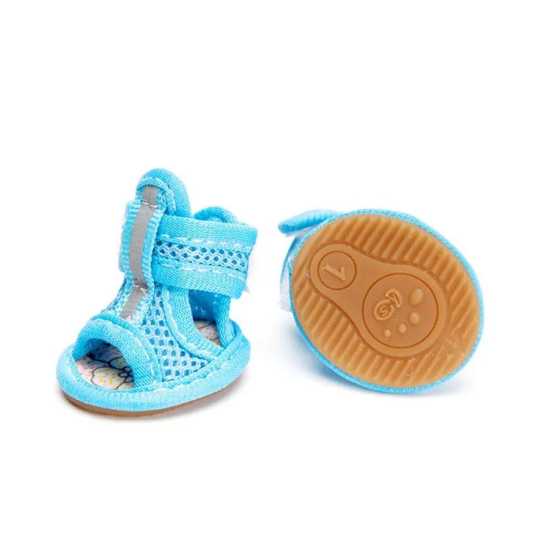 Blue children's sandal with a textured brown sole on a white background
