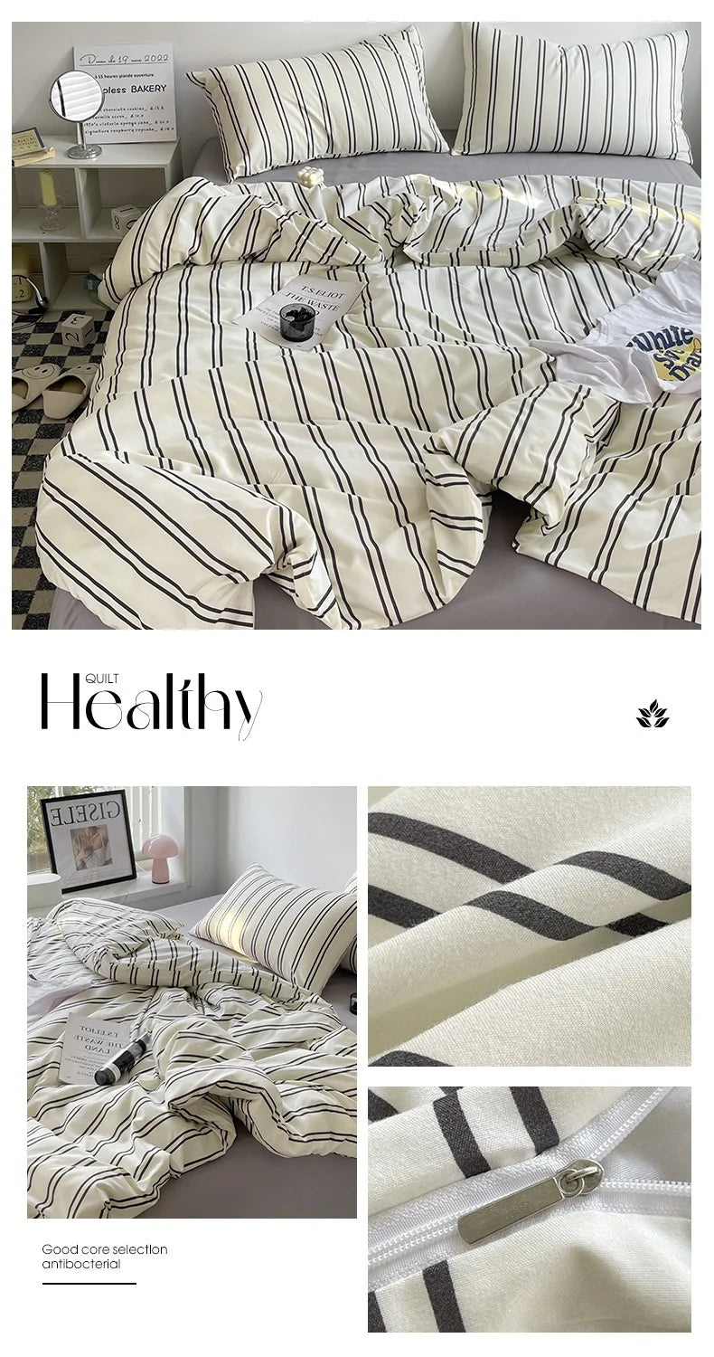 Striped bedding set with a comforter and pillows on a bed, featuring the brand 'Healthy'.