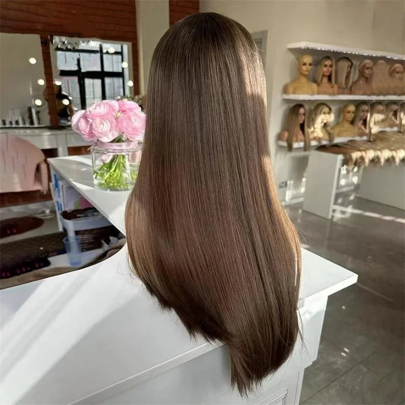 Person with long brown hair in a salon setting