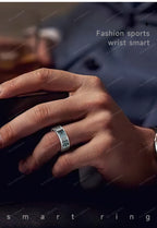 Hand wearing a smart ring with text 'Fashion sports wrist smart' and 'smart ring' on a dark background.