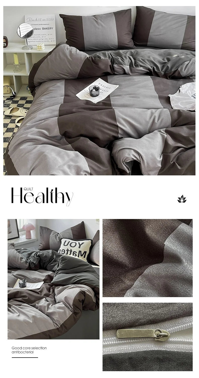Gray and brown checkered bedding set with a zipper detail, placed on a bed.