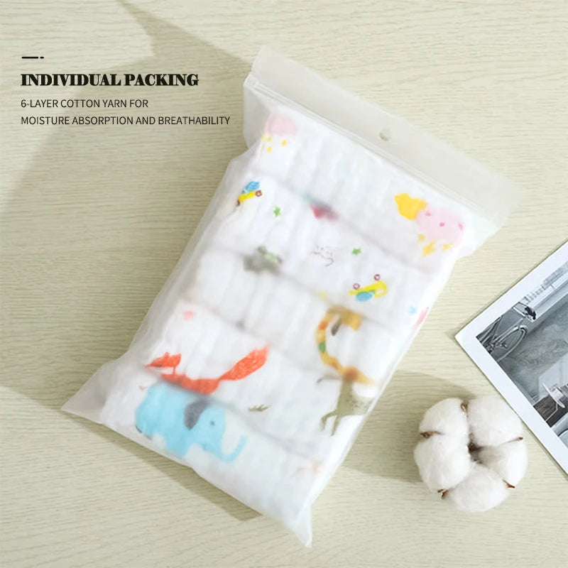 Packaged cotton yarn with cartoon designs on a light wooden surface.
