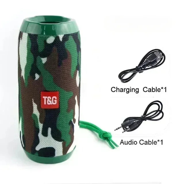 Camouflage-patterned speaker with T&G logo, charging cable, and audio cable on a white background