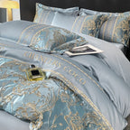 Luxury bedding set with floral patterns and 'CHANELS COCO' text on a bed.