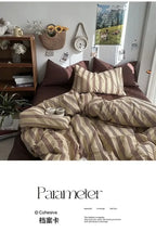 Bed with striped bedding in a room with a bookshelf and decor items.