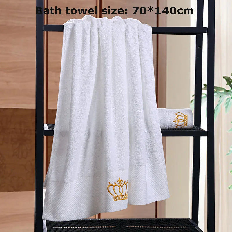 White bath towel with a gold crown logo on a black towel rack, size 70*140cm.