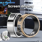 Two smart rings with screen display and charging box on a gray surface.