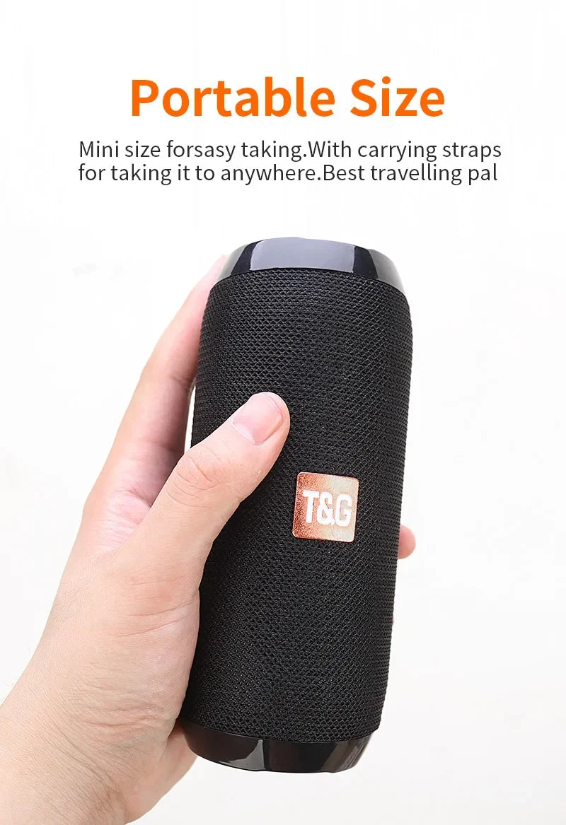 Black portable speaker held in a hand with text about its portability and travel-friendly design.